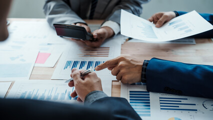 Team of male bookkeepers people working with balance sheet to analyze problems and find solutions to develop business organization and company's stock market system. Common stock and preferred stock