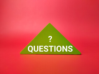 Colored wooden puzzle with the word QUESTION