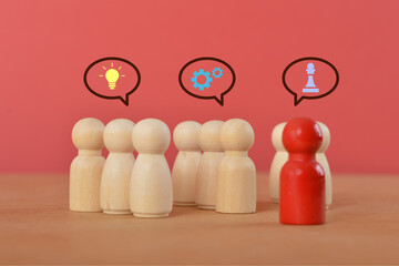 A team of individuals with light bulb and cogwheel icons, as well as a chess set inside,...