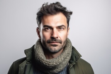 Medium shot portrait photography of a pleased man in his 30s wearing a cozy sweater against a white background. Generative AI