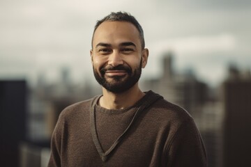 Portrait of a handsome young man with beard in the city.