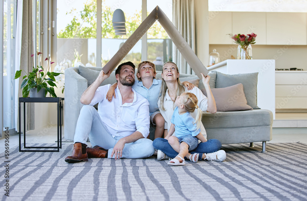 Canvas Prints What do you see when you look up. Full length shot of an affectionate family of four holding a cardboard roof over their heads while sitting in the living room at home.