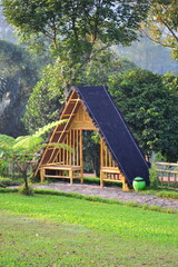 gate-style house in the woods