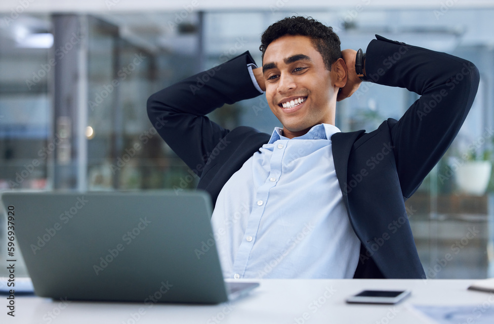 Canvas Prints Ive accomplished all that I set out to do. Shot of a young businessman taking a break while working on a laptop in an office.