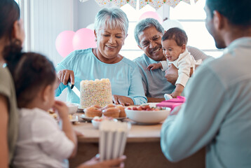 Love is sharing. Shot of a family celebrating a birthday together at home.