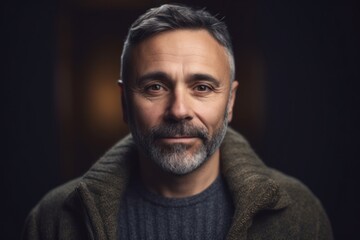 Obraz premium Medium shot portrait photography of a pleased man in his 40s wearing a cozy sweater against an abstract background. Generative AI