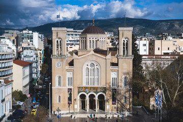Fototapeta na wymiar Metropolitan Cathedral of of the Annunciation, Metropolis, Mitropoli facade exterior view, Attica, Athens, Grece, in a summer sunny day with a blue sky, the cathedral church of the Archbishopric