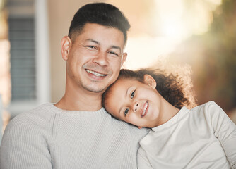 Fototapeta premium We grow in different directions yet our roots remain one. Shot of a father and daughter on the sofa at home.