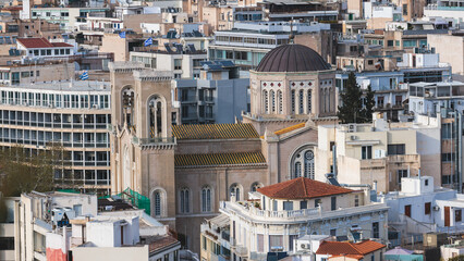 Fototapeta premium Metropolitan Cathedral of of the Annunciation, Metropolis, Mitropoli facade exterior view, Attica, Athens, Grece, in a summer sunny day with a blue sky, the cathedral church of the Archbishopric