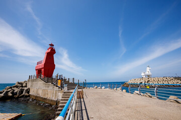 Wonderful Iho Tewoo Beach two horse shaped lighthouses. Jeju Island, South Korea