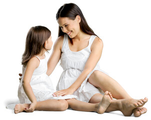 Happy mother and her daughter in white dress