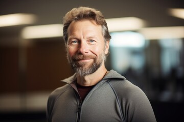 Obraz premium Portrait of a handsome middle-aged man in sportswear