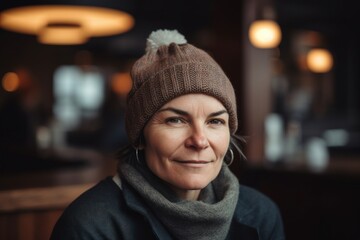 Portrait of a middle-aged woman in a knitted hat and scarf