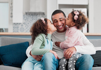 Nobody prepared me for how much love I have for them. Shot of two little girls giving their father a kiss on the cheek at home.