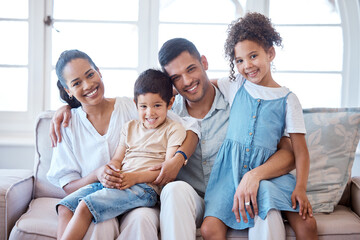 Its about how happy the home is. Portrait of a happy family bonding together at home.