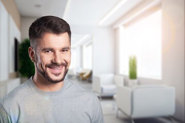 Young happy handsome man posing