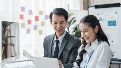 Asian male and female business partners for company registration Working with computer working together, Accrual Basis, conversion Costs, Capital Stock, Current Liabilities, Cash Short and Over