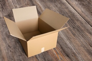 One open classic cardboard box on background