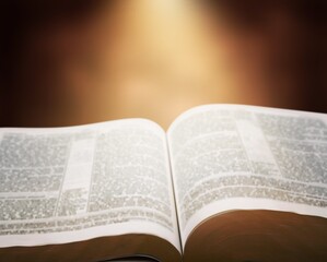 Open Bible book on wooden table