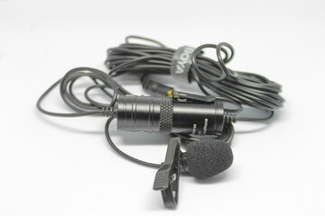 Surabaya, Indonesia - April 2023 : wired microphone isolated object black color on white background