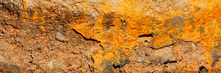 Rust of metals.Corrosive Rust on old iron with a hole. Rusted orange painted metal wall. Rusty metal background with streaks of rust. Old shabby paint.metal rust texture background