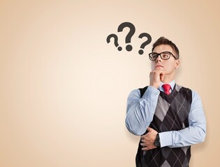 A thoughtful young man with a question mark
