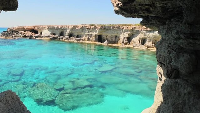 Sea cave arch viewpoint near Cape Greko, Capo Greco, Ayia Napa and Protaras on Cyprus island, Mediterranean Sea. Breathtaking seascape. Turquoise crystal clear waters in sunny day