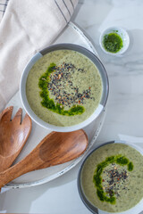 Healthy creamy soup with fresh ramson or wild garlic leaves