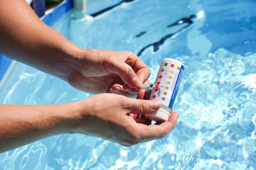 Swimming pool test water on ph and chemical balance.