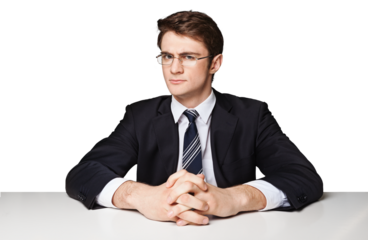 serious businessman sitting at office desk