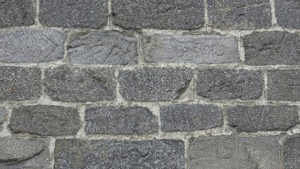 Detail of a stone wall with different size of rocks.