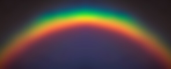 Rainbow defocus arc shape on dark sky empty background. 