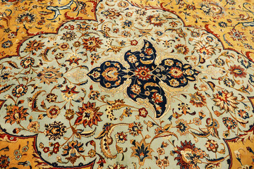 Fototapeta na wymiar Fragment of oriental ornament of ancient handmade floor carpet close-up