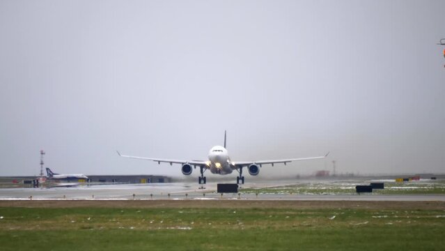 Airbus A330 Takeoff From the Runway, Cloudy Day, Low Angle Belly View.