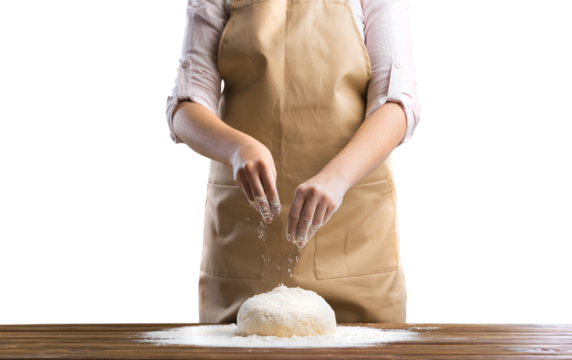 Hands cooking homemade bread dough on wooden table
