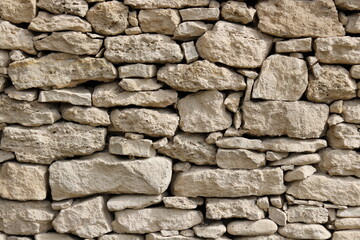 old wild stone wall without mortar    