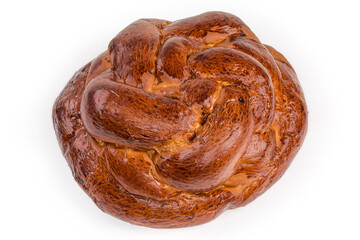 Baked sweet braided bread on a white background, top view