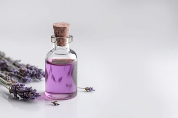Bottles of essential oil for aromatherapy, alternative medicine and fresh lavender flowers on light background. Generative AI.