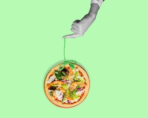 Contemporary collage of human hand with pizza.
