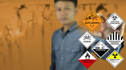 The inspector or officer show symble of dangerous goods such as explosives in his hand.
