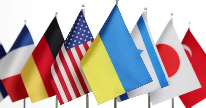 Flag of ukraine standing in front of flags of world 4k movie. International humanitarian financial assistance to ukrainian people during war with russia concept