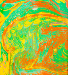 Ink marble texture. Ebru handmade background. Abstract green orange and yellow background. Unique art illustration. Liquid marbling texture.