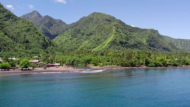 Aerial Reveal Shot of Tahitian Beach with Mountains and Jungles at Teahupo'o on Tahiti Iti