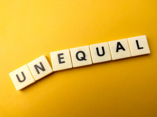 Toy word with the word UNEQUAL