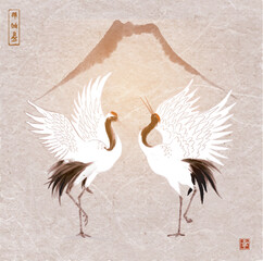 Two dancing crane birds and Fujiyama mountain on vintage background. Traditional oriental ink painting sumi-e, u-sin, go-hua. Hieroglyphs - zen, freedom, nature, happiness