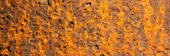 Rust of metals.Corrosive Rust on old iron with a hole. Rusted orange painted metal wall. Rusty metal background with streaks of rust. Old shabby paint.metal rust texture background
