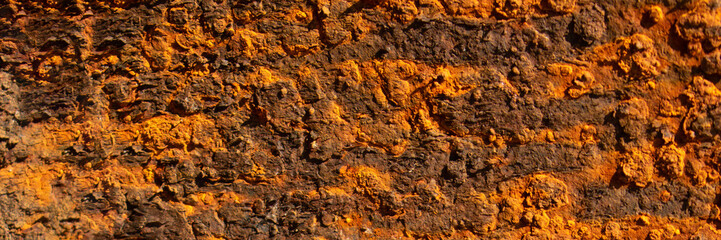 Rust of metals.Corrosive Rust on old iron with a hole. Rusted orange painted metal wall. Rusty metal background with streaks of rust. Old shabby paint.metal rust texture background