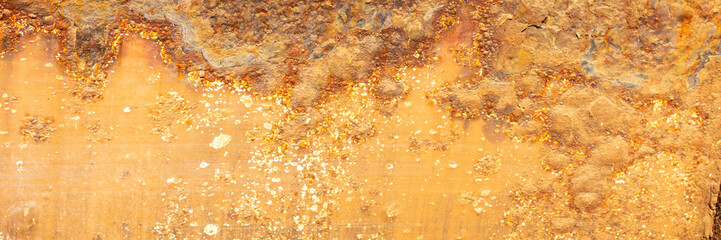 Rust of metals.Corrosive Rust on old iron with a hole. Rusted orange painted metal wall. Rusty metal background with streaks of rust. Old shabby paint.metal rust texture background