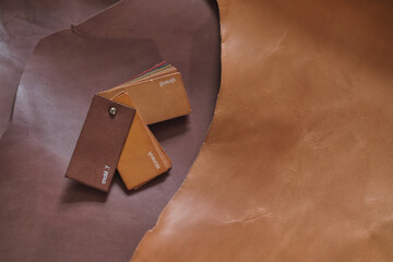 selection of top-notch beige leather cuts in different shades, demonstrating the range of colors available for designers and artisans. color grading and matching in leather industry. Grading the Hues