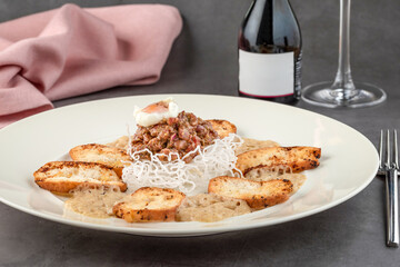 Veal tartare on stone table in fine dining restaurant